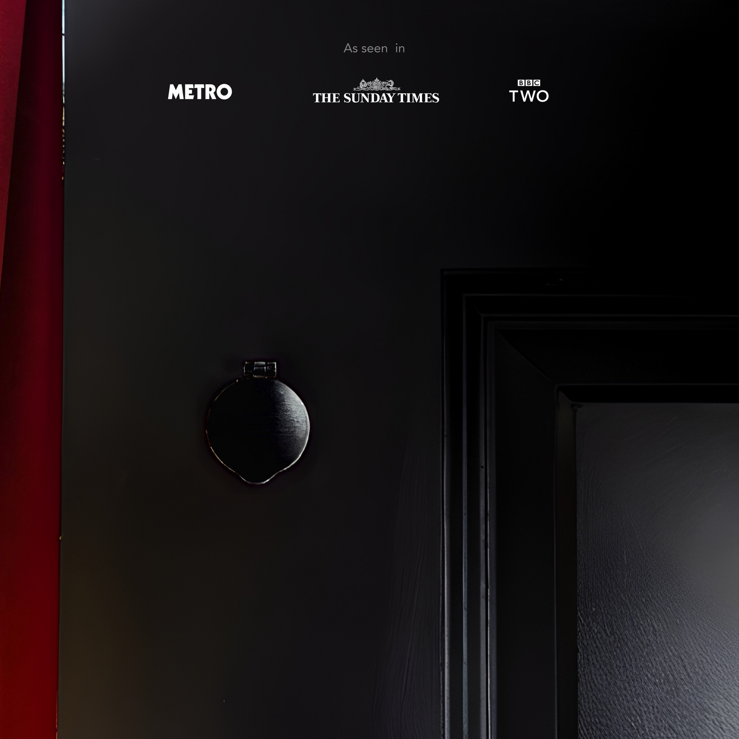 Black Mini Magflap magnetic keyhole cover installed on traditional timber door.