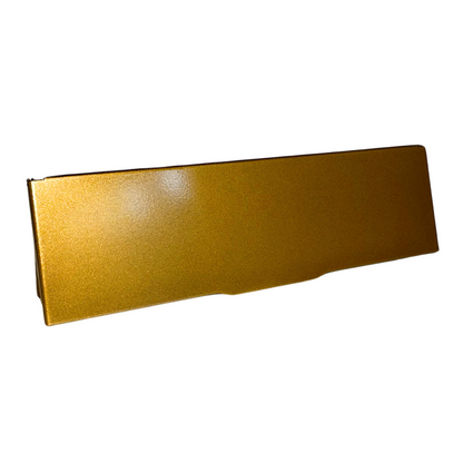 A gold-colored horizontal letterbox draught excluder made of metal with a smooth surface.